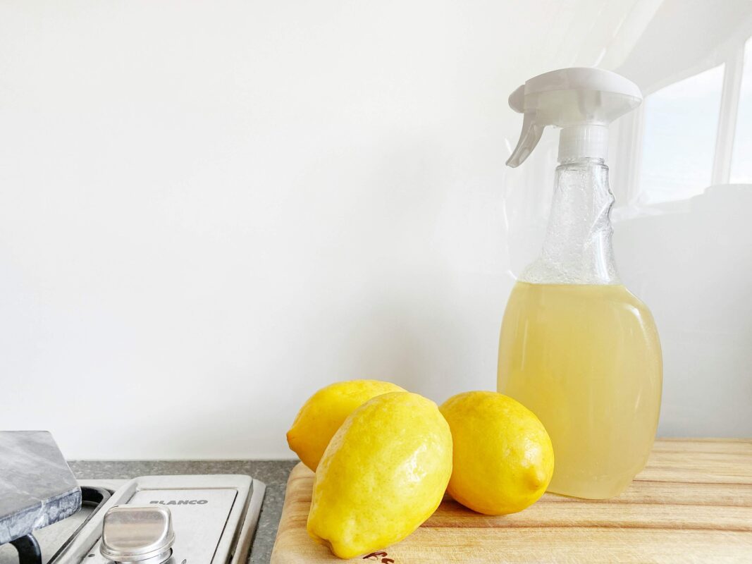 Lemons and a container of home made cleaning spray.