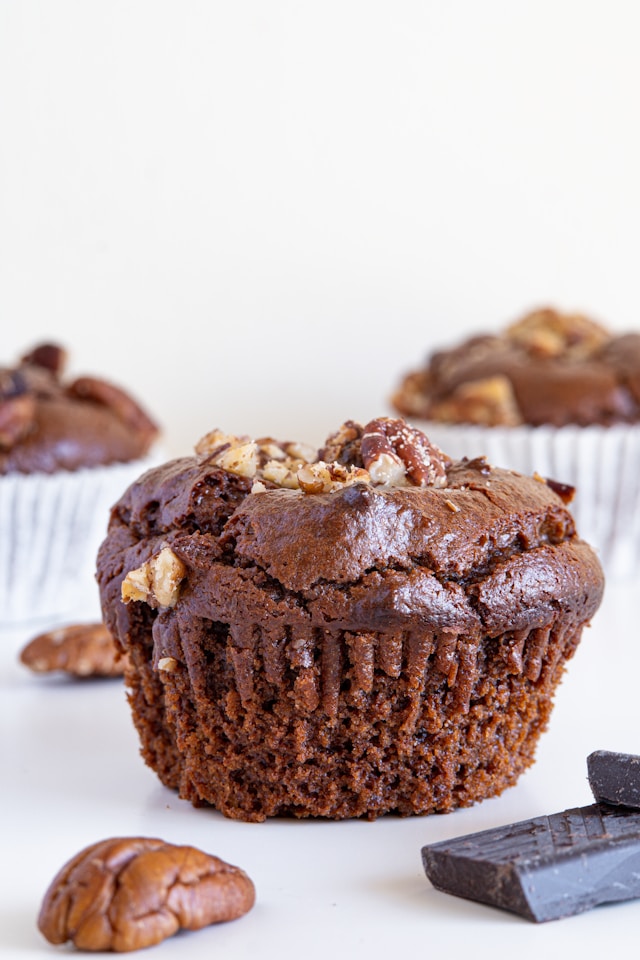 close up of a apple and pecan muffin