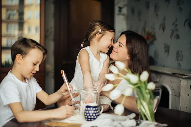 woman playing with her children