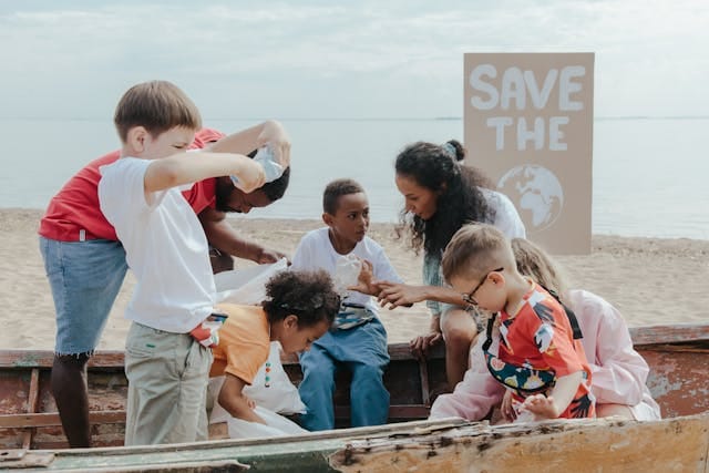 Kids collecting plastics to clean up the planet